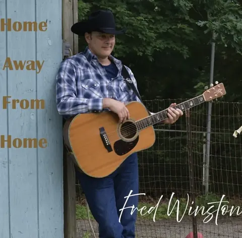 Fred Winston with his acoustic guitar — Home Away From Home